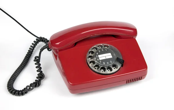 stock image Red old telephone isolated