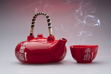 Chinese teapot with steaming cup clipart