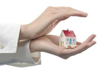 Hands with a little house clipart