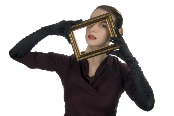 Kobieta patrząc przez ramki na zdjęcia — Zdjęcie stockowe
