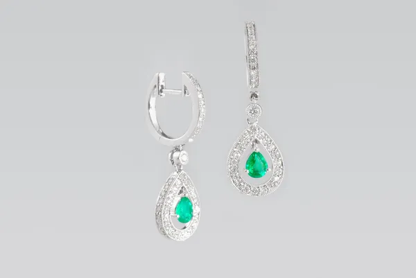 Two silver earrings with diamonds — Stock Photo, Image