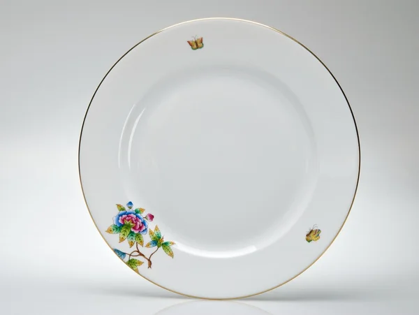 El-boyalı boş yemek tabağı — Stok fotoğraf