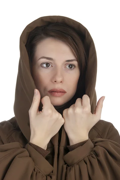 Cheerful young woman holding her hood — Stock Photo, Image