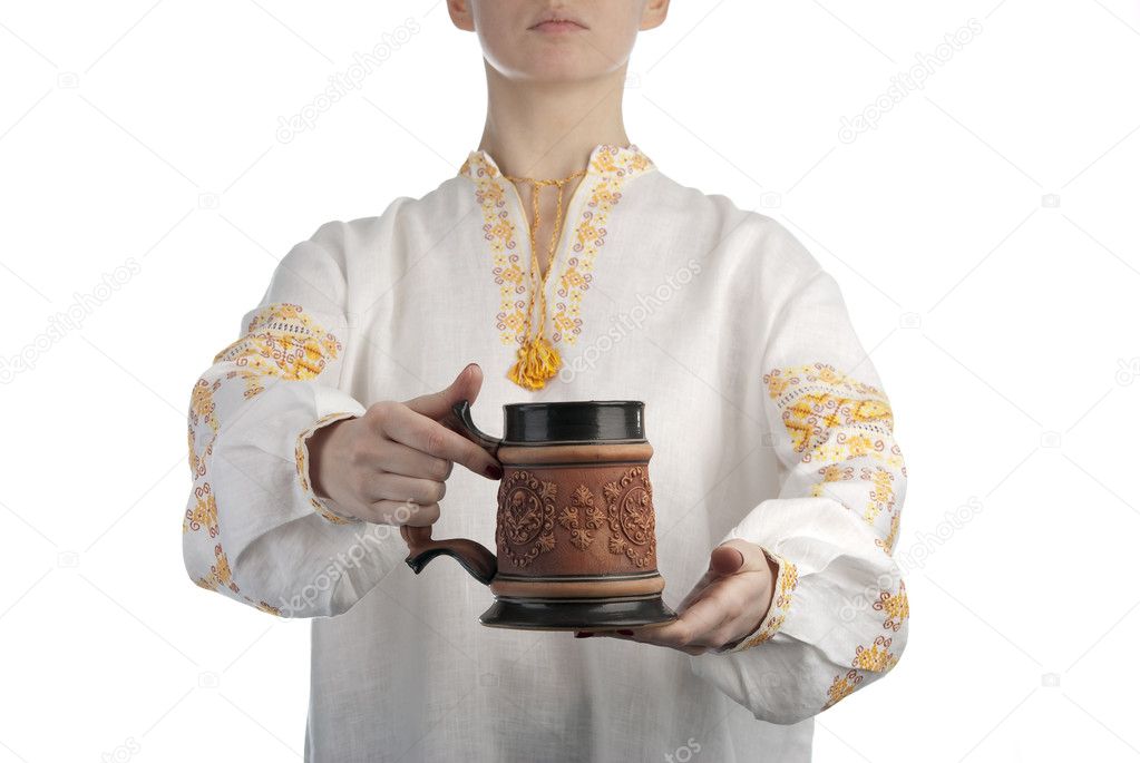 Woman's hand holding beer mug