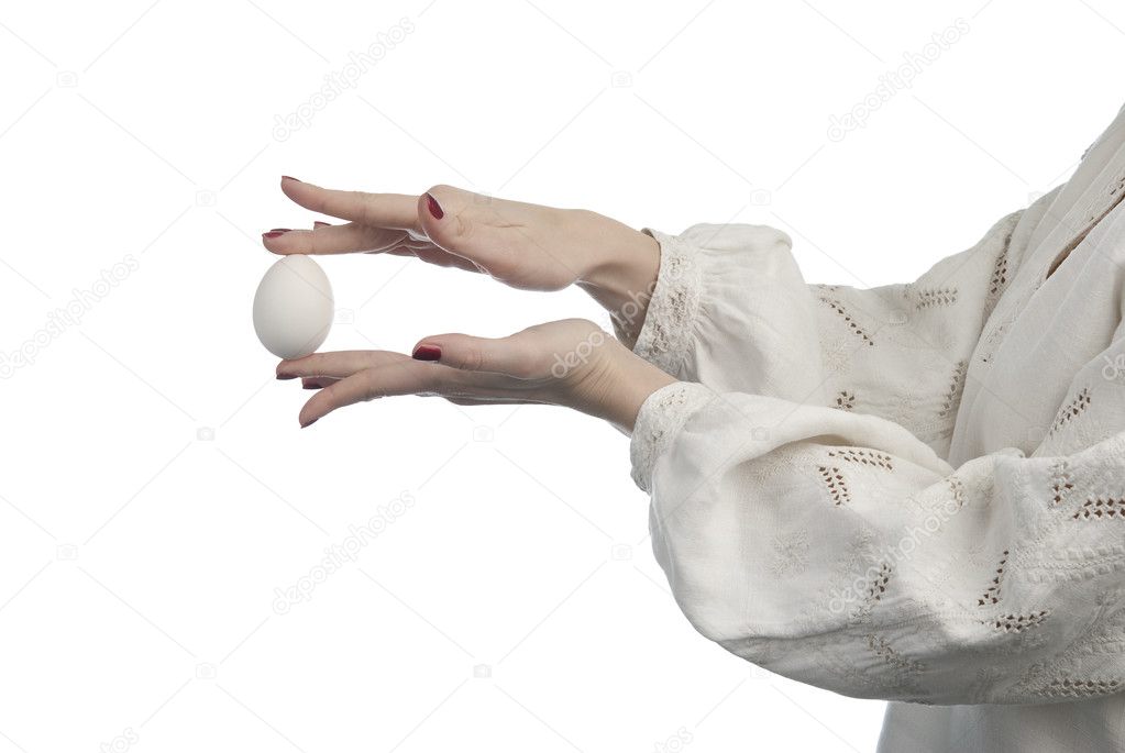 Woman's hands holding the egg
