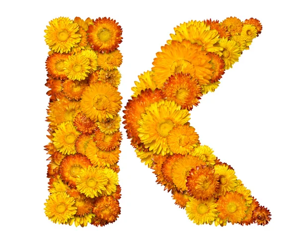 字母表从黄色和橙色的花朵 — 图库照片