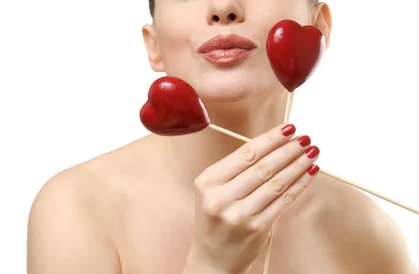 Beautiful woman holding two red hearts. — Stock Photo, Image