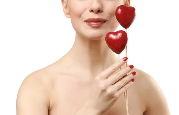 Beautiful woman holding two red hearts. — Stock Photo, Image