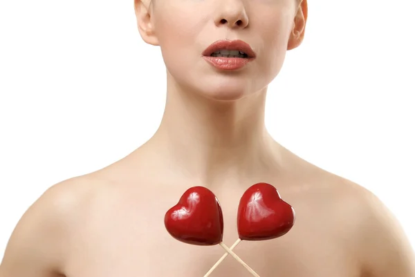 Beautiful woman holding two red hearts c — Stock Photo, Image