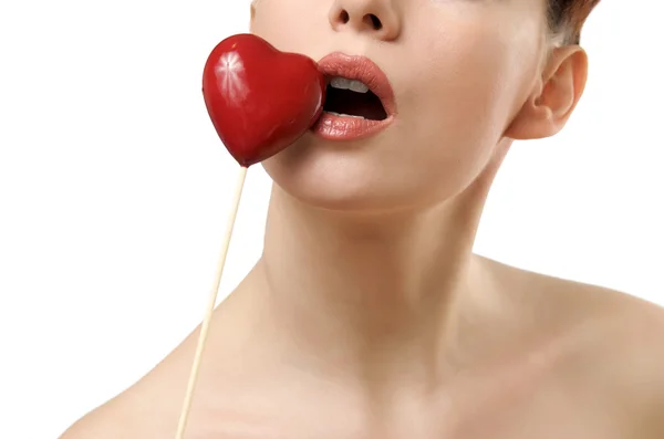 Beautiful woman kissing red heart. — Stock Photo, Image