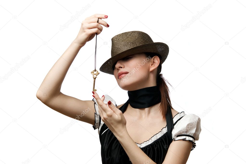 Woman wearing hat showing key shaped pen