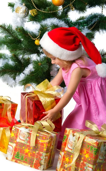 Cute xmas girl wihts gifts Stock Picture