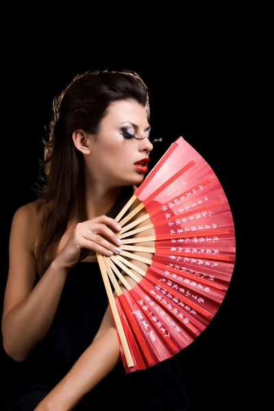 Hermosa mujer con ventilador — Foto de Stock