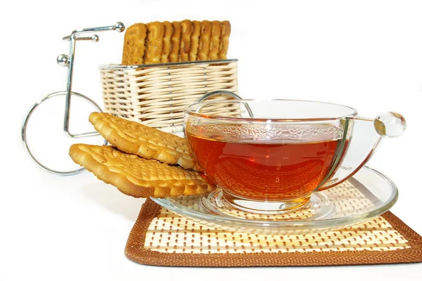 Bicicleta, biscoitos e uma xícara de chá — Fotografia de Stock