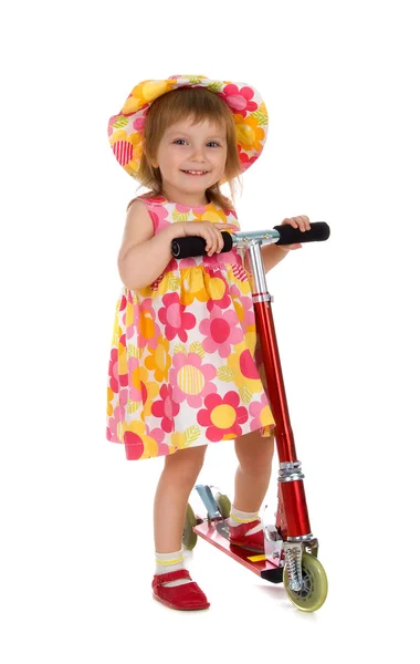Menina bonito e sua scooter — Fotografia de Stock