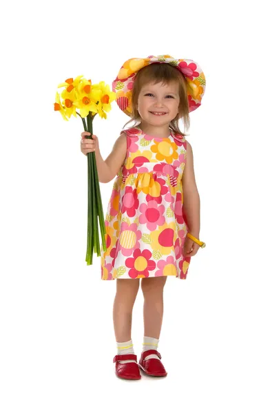Cute little girl giving flowers — Stock Photo, Image