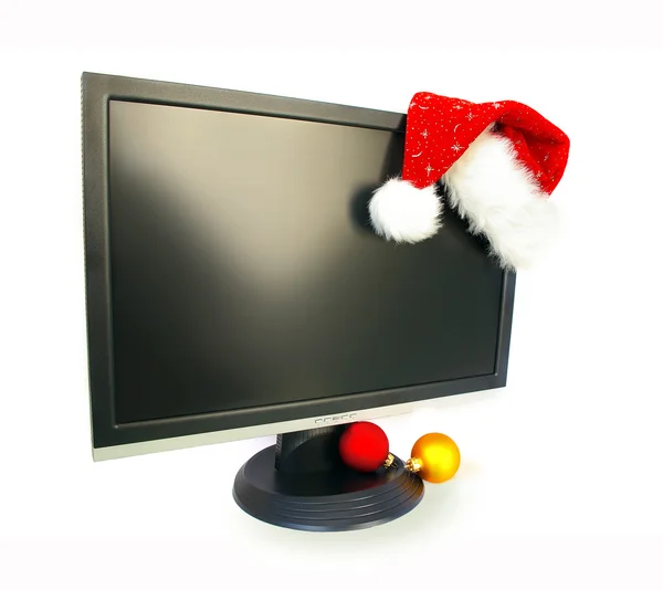 Monitor e chapéu de Papai Noel — Fotografia de Stock