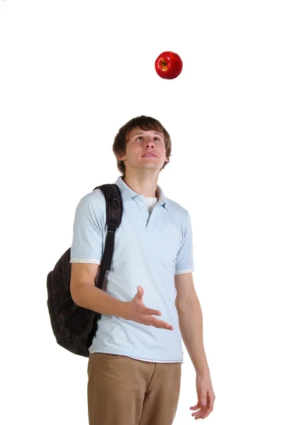 若い学生は赤いりんごを投げる — ストック写真