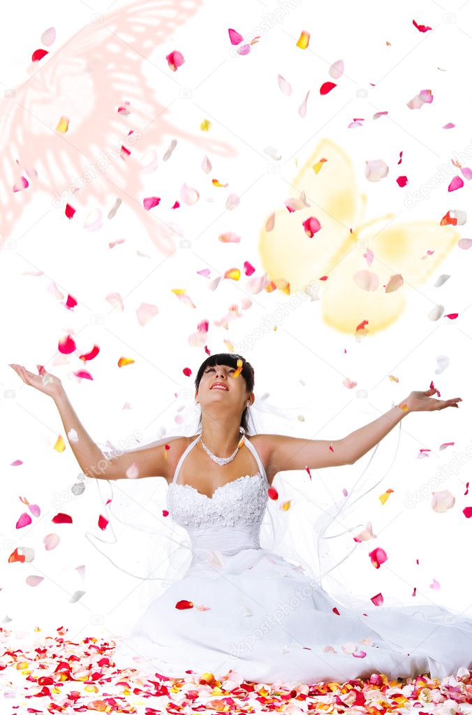Cute bride throws rose petals and butter