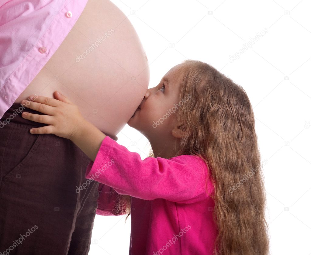 Cute little girl and her pregnant mother