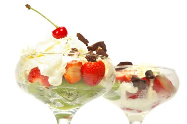 Ice cream with whipped cream and kiwi clipart