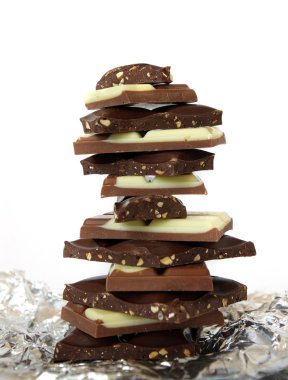 Stack of chocolate blocks on white clipart