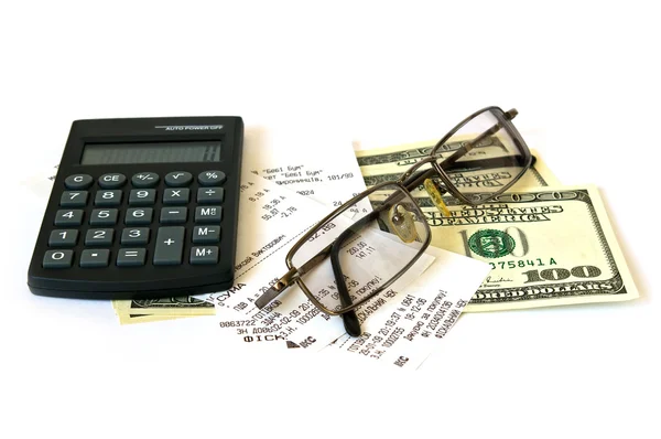 Calculadora e dólares em backgrou branco — Fotografia de Stock