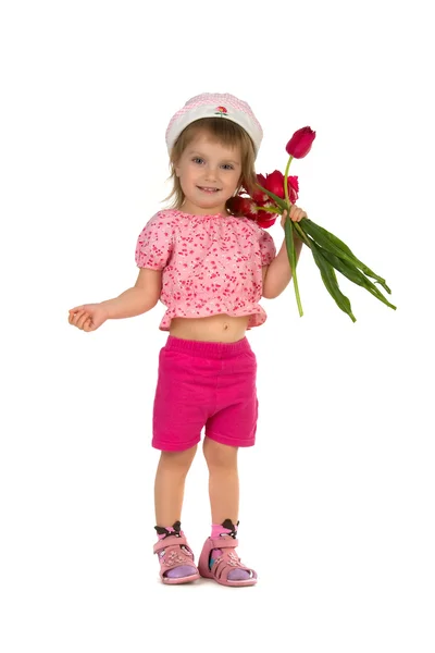 Roztomilá dívka dává tulipány — Stock fotografie