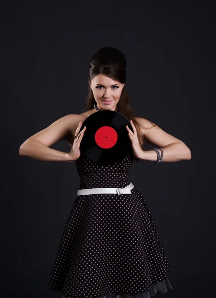 Mujer linda con disco de gramófono —  Fotos de Stock