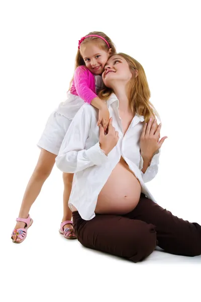 Niña y su madre embarazada — Stockfoto