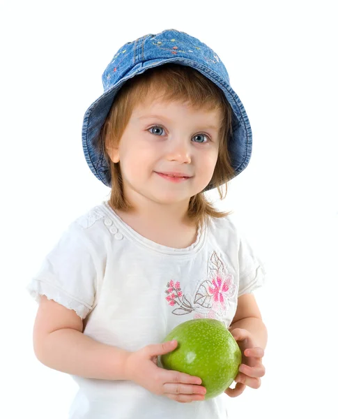 Weinig meisje en groene appel — Stockfoto