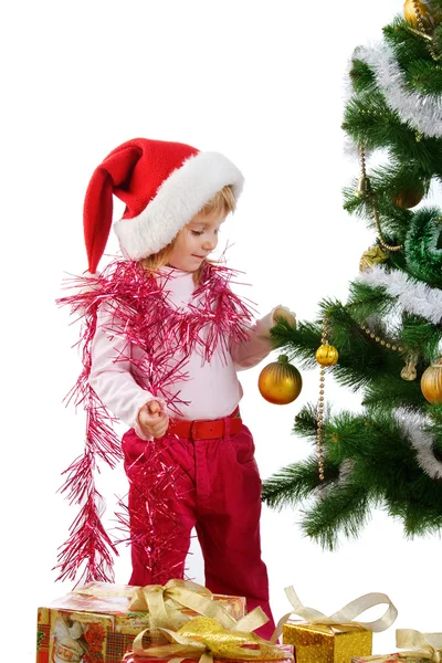 Little girl near the christmas tree and — Stock Photo, Image