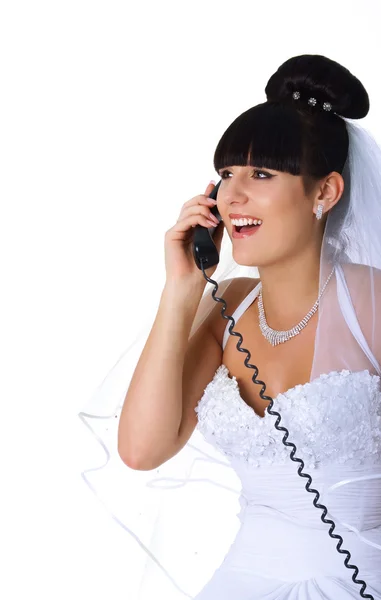 Pretty bride speaks on the phone — Stock Photo, Image