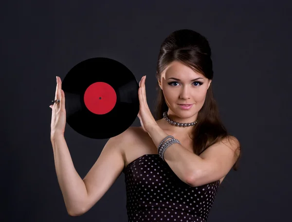 Pretty woman with gramophone record — Stock Photo, Image