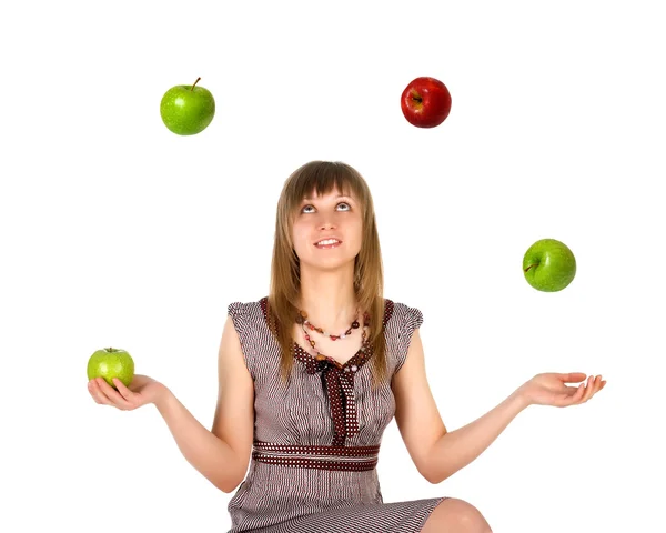 Žena žonglování s jablky — Stock fotografie