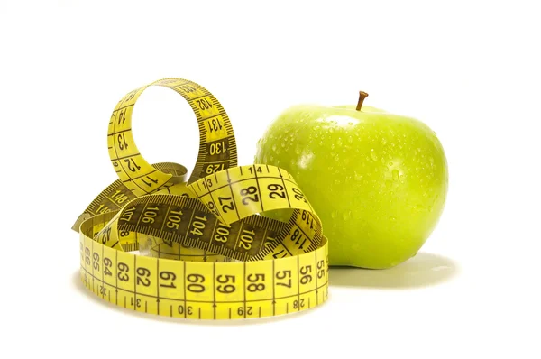 Yellow apple and tape measure — Stock Photo, Image