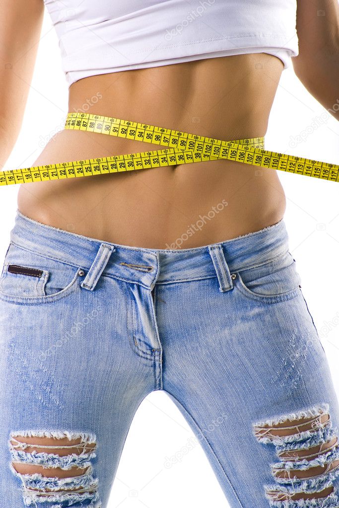 Woman measuring her small waist