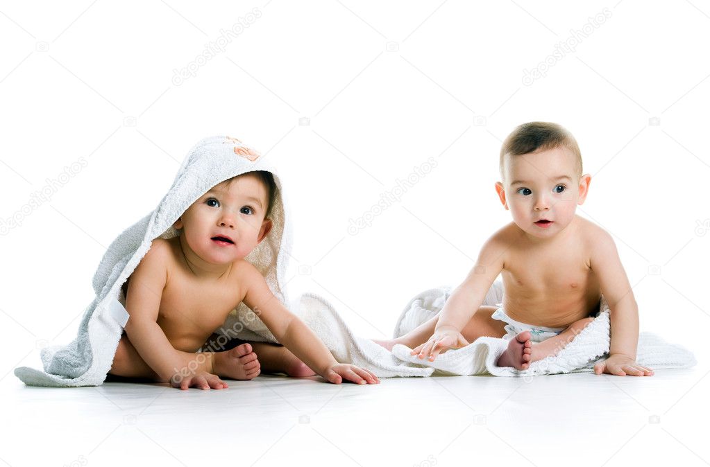 Twin brothers with towels