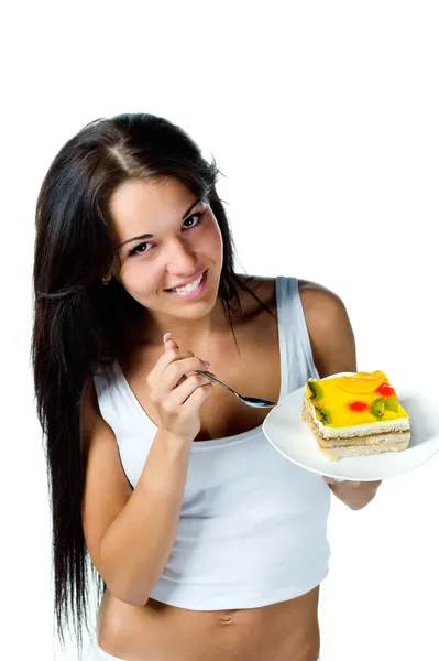 Donna attraente mangiare torta — Foto Stock