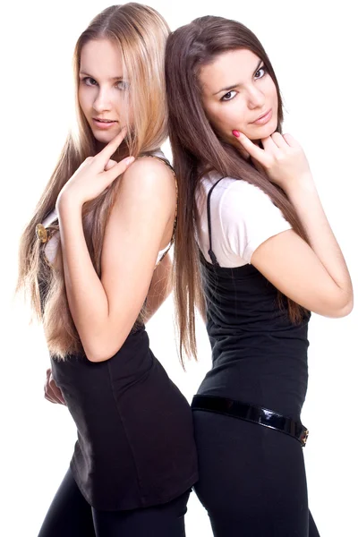 Zwei schöne Frauen in einem farbigen Kleid — Stockfoto