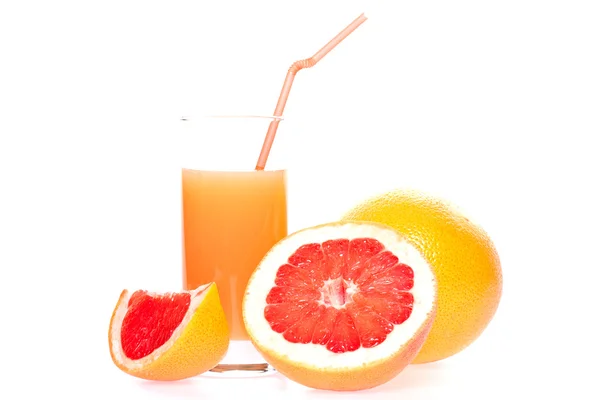 Grapefruit and juice in glass — Stock Photo, Image