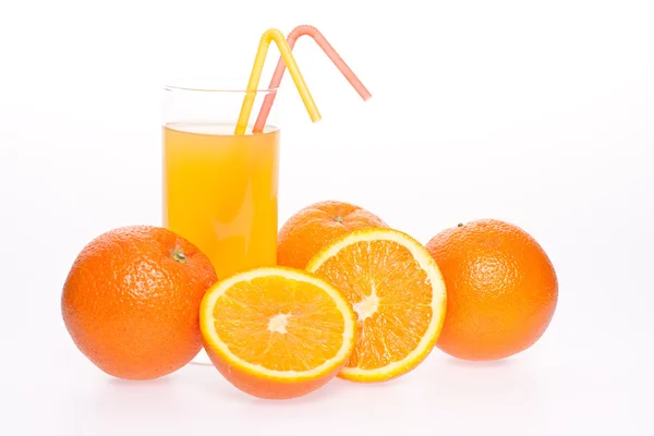 Grapefruit and juice in glass — Stock Photo, Image