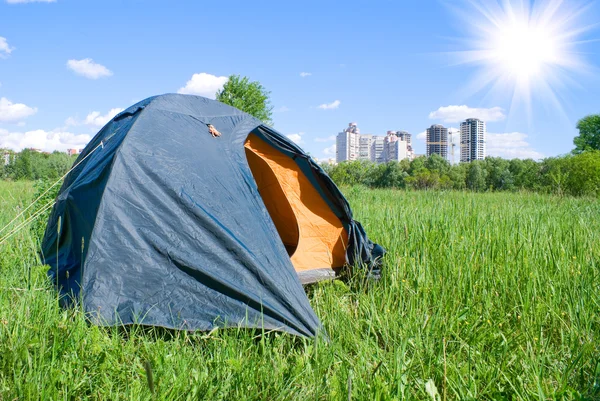 Tourist tent on a background town houses — Stock Photo, Image