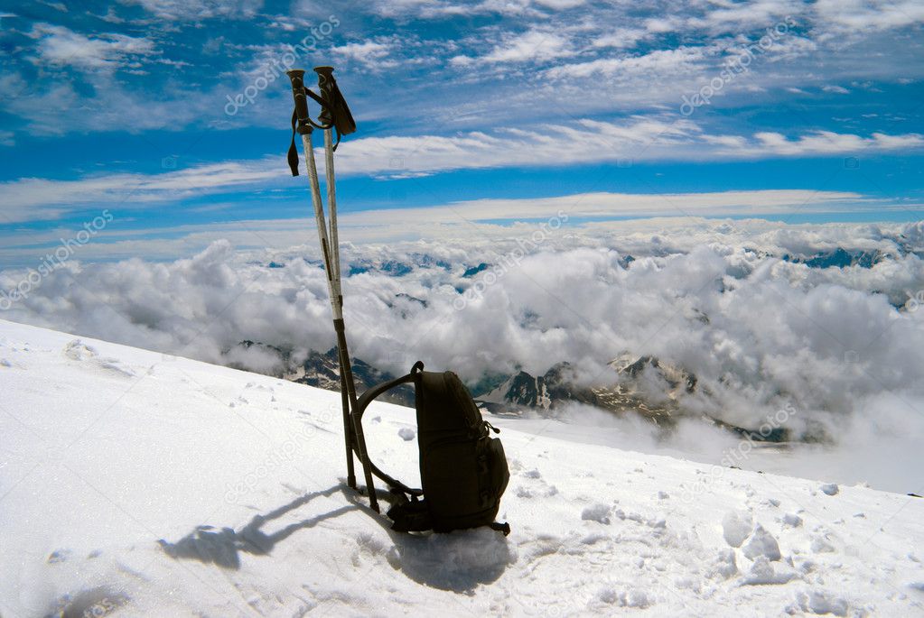 Ski poles and backpack cost on to snow