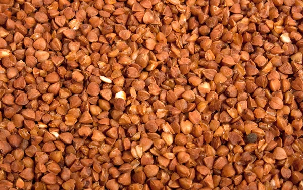 Marrón trigo sarraceno alimentos fondo —  Fotos de Stock