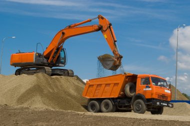 Excavator and dump truck clipart