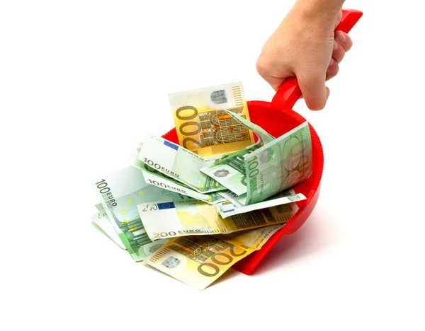 Hand, dustpan, money — Stock Photo, Image