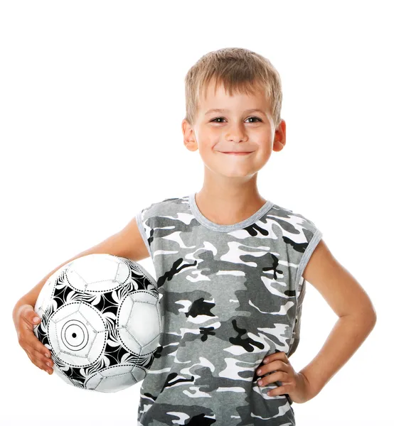 Pojken håller fotboll — Stockfoto