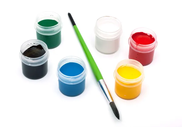Paints with a paintbrush — Stock Photo, Image