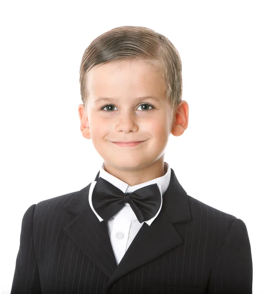 Pojke i en kostym ler — Stockfoto